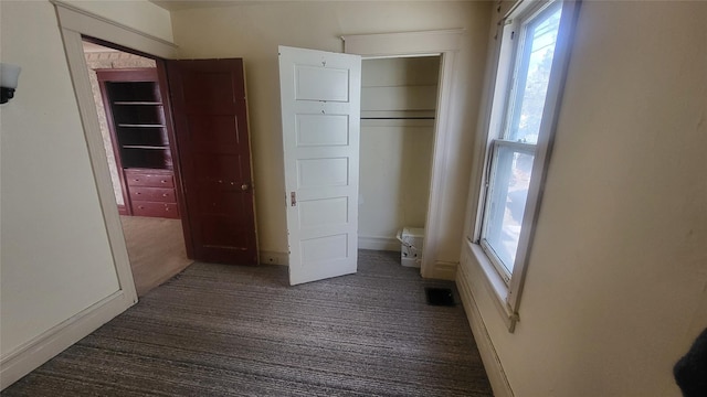 unfurnished bedroom featuring baseboards