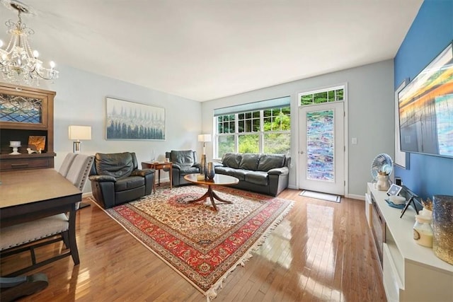 living room with a chandelier and hardwood / wood-style flooring