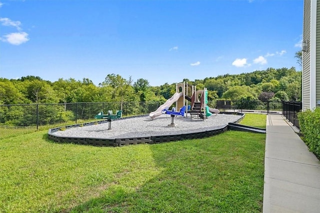 view of playground with a lawn