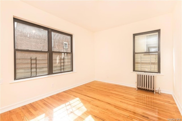 204 W 260th St, Bronx, NY 10471 - spare room featuring radiator and wood finished floors