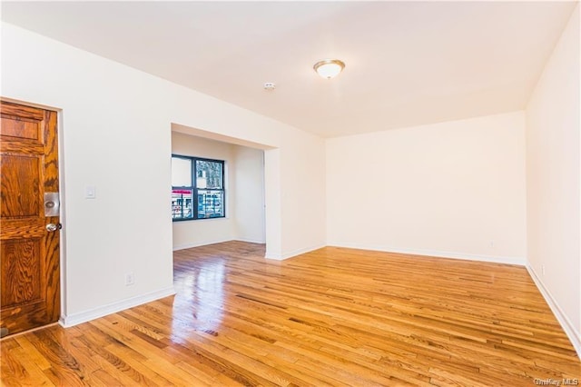 204 W 260th St, Bronx, NY 10471 - empty room featuring light wood finished floors and a smoke detector