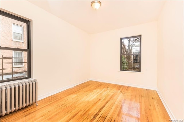 204 W 260th St, Bronx, NY 10471 - spare room featuring radiator and light wood-type flooring