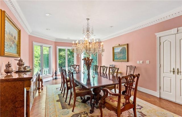 dining space with light parquet flooring, crown molding, and a notable chandelier