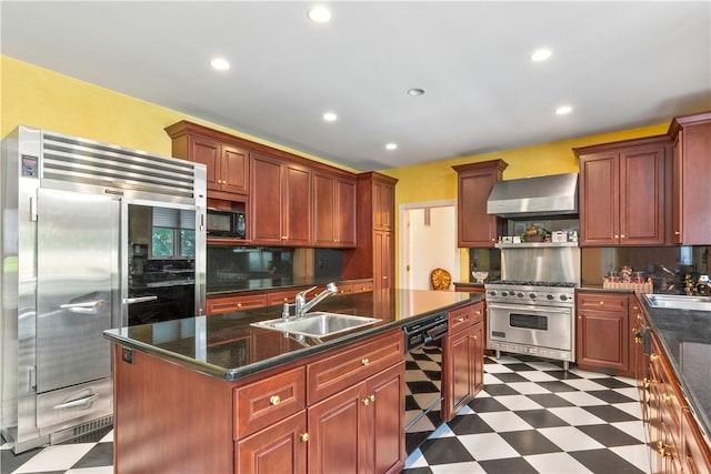 kitchen featuring a center island with sink, black appliances, extractor fan, and sink