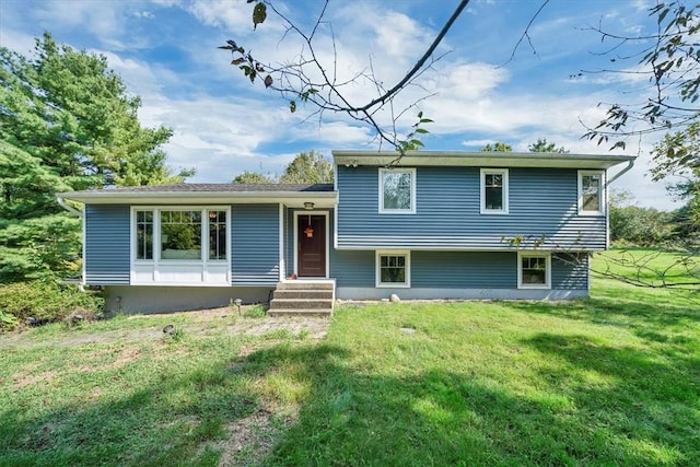 tri-level home with a front yard