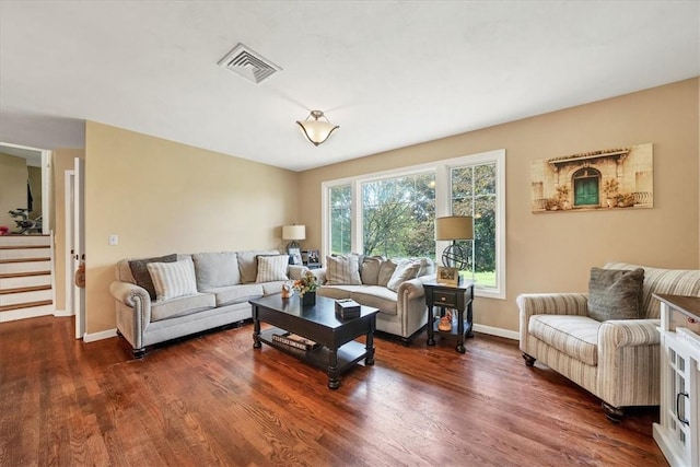 living room with dark hardwood / wood-style flooring