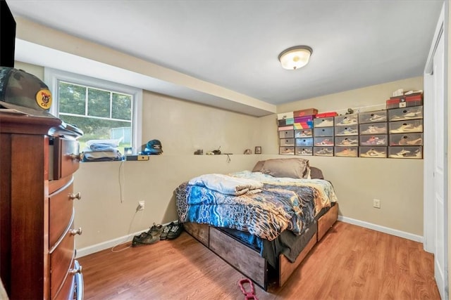 bedroom with hardwood / wood-style floors