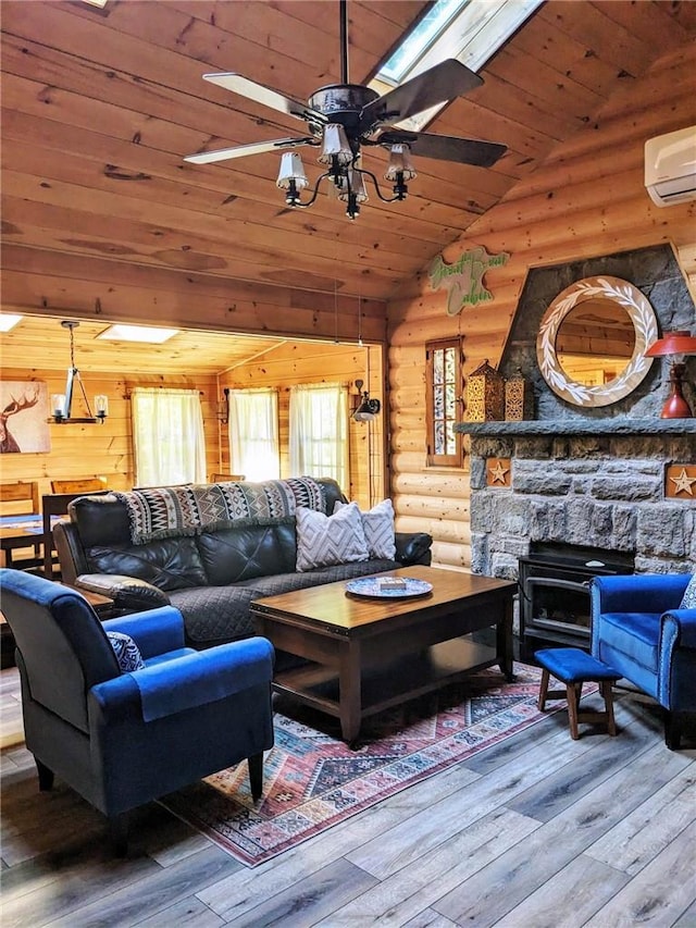 living room featuring a wall mounted air conditioner, wood ceiling, ceiling fan, hardwood / wood-style floors, and lofted ceiling