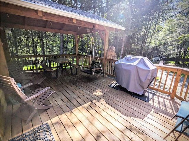 wooden deck with area for grilling