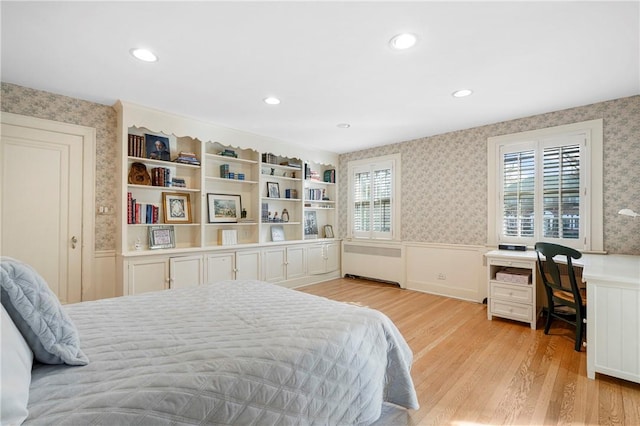 290 Overlook Rd, New Rochelle, NY 10804 - bedroom featuring a wainscoted wall, wallpapered walls, light wood-type flooring, radiator heating unit, and a desk