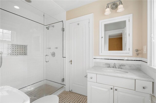 bathroom with vanity and an enclosed shower