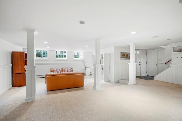 290 Overlook Rd, New Rochelle, NY 10804 - basement featuring light carpet, wainscoting, stairway, a decorative wall, and baseboard heating