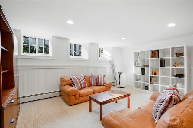 living room featuring light colored carpet and baseboard heating