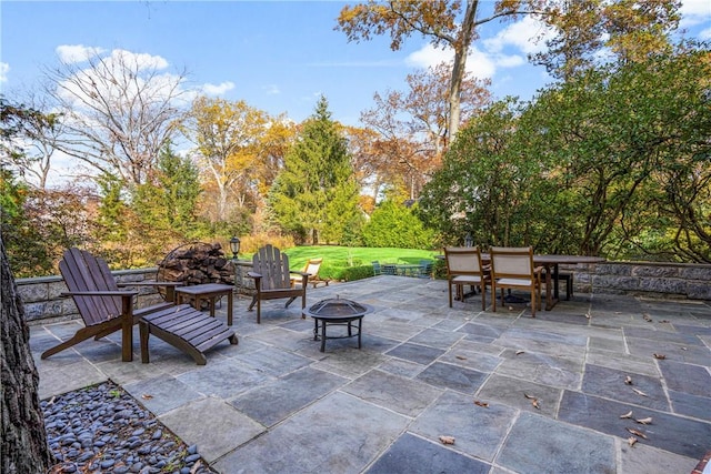 view of patio / terrace with an outdoor fire pit