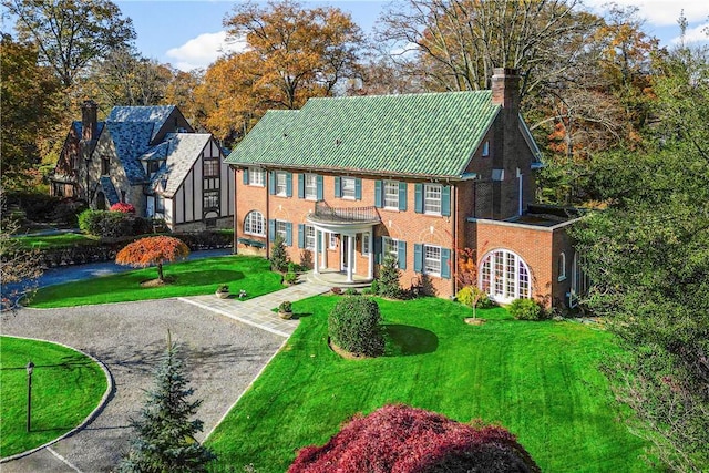290 Overlook Rd, New Rochelle, NY 10804 - view of front facade with a chimney and a front lawn