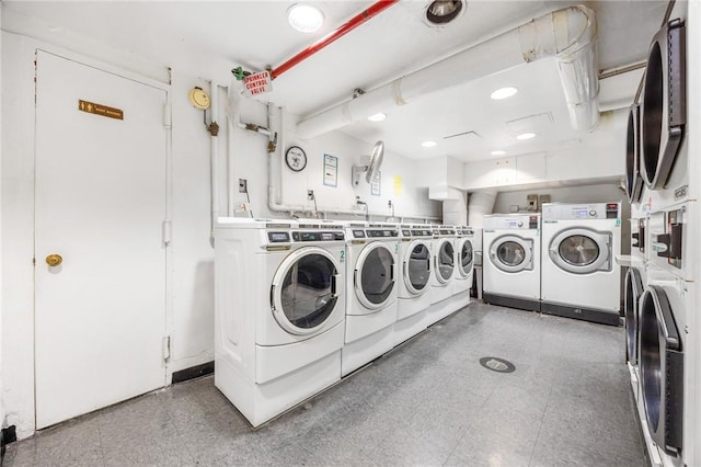 clothes washing area with washer and dryer