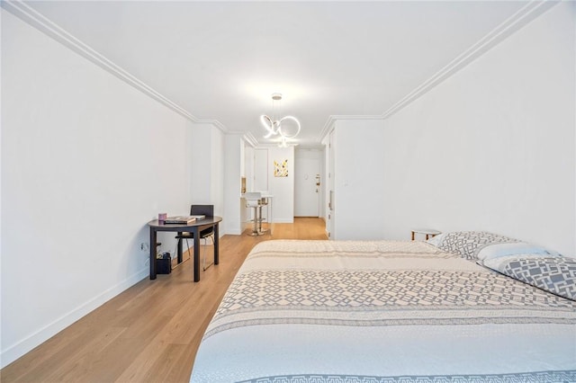 bedroom featuring light hardwood / wood-style floors and ornamental molding