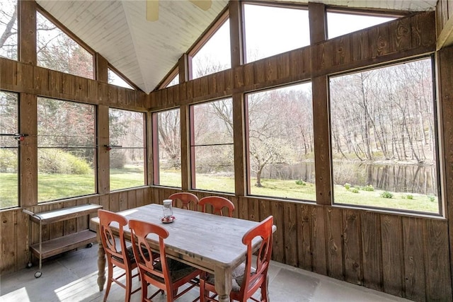 sunroom featuring ceiling fan and lofted ceiling