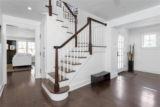 entryway featuring dark hardwood / wood-style floors and a healthy amount of sunlight