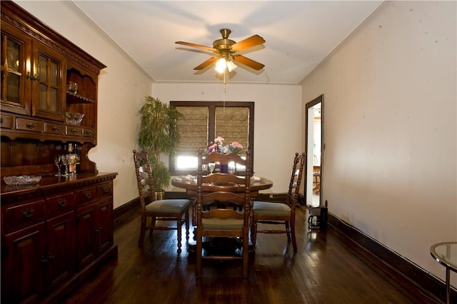 dining space with dark hardwood / wood-style floors and ceiling fan