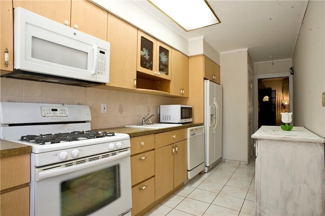 kitchen with white appliances, sink, ornamental molding, light tile patterned floors, and tasteful backsplash