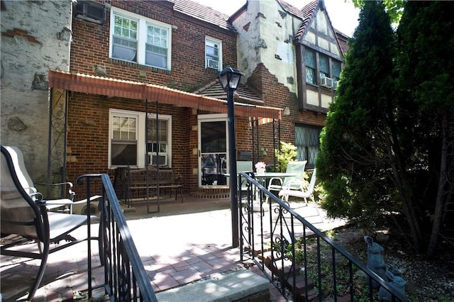 back of house with a patio