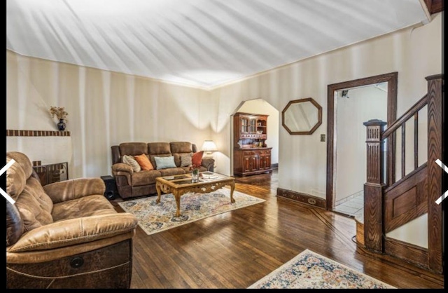 living room featuring dark wood-type flooring