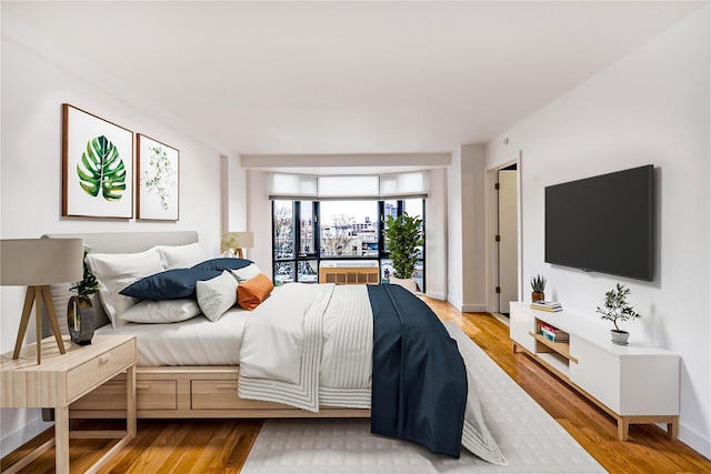 bedroom with light hardwood / wood-style flooring