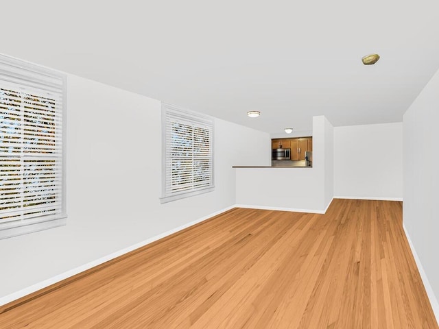 unfurnished living room featuring light hardwood / wood-style flooring