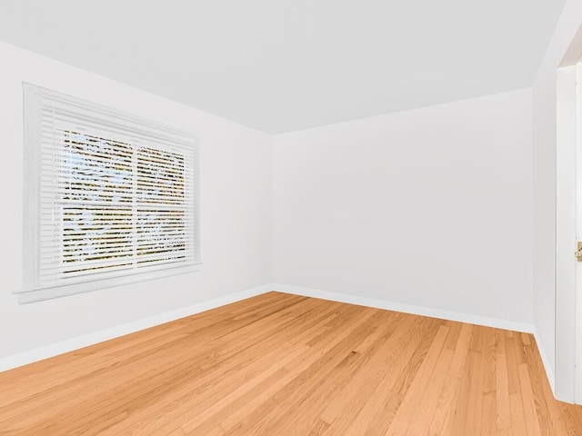 unfurnished room featuring wood-type flooring