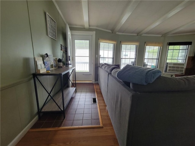 living room featuring vaulted ceiling with beams, dark hardwood / wood-style floors, and cooling unit