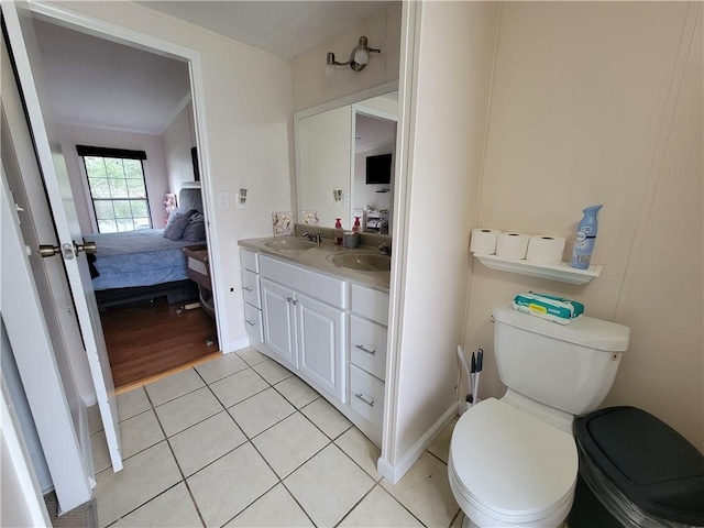 bathroom with tile patterned floors, vanity, and toilet