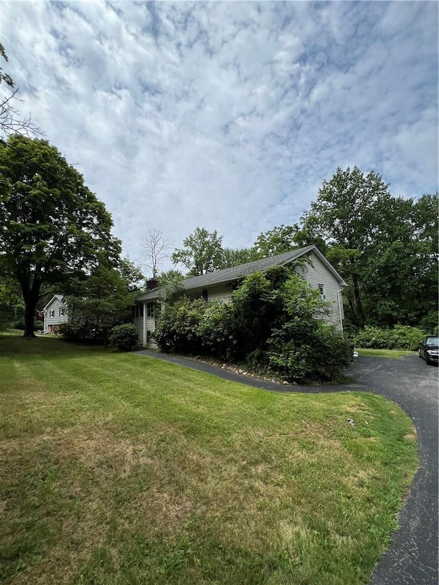 view of home's exterior featuring a lawn