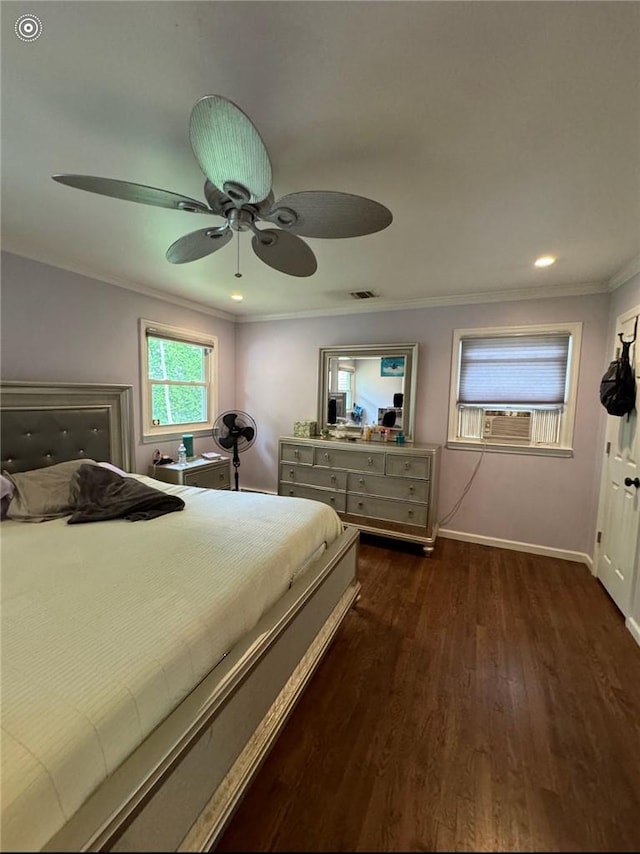 bedroom with ceiling fan, dark hardwood / wood-style flooring, and ornamental molding