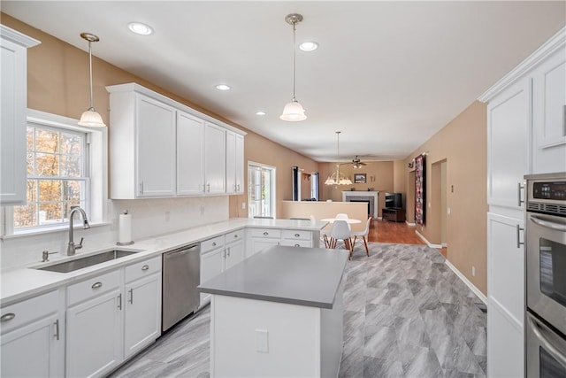 kitchen featuring appliances with stainless steel finishes and white cabinetry