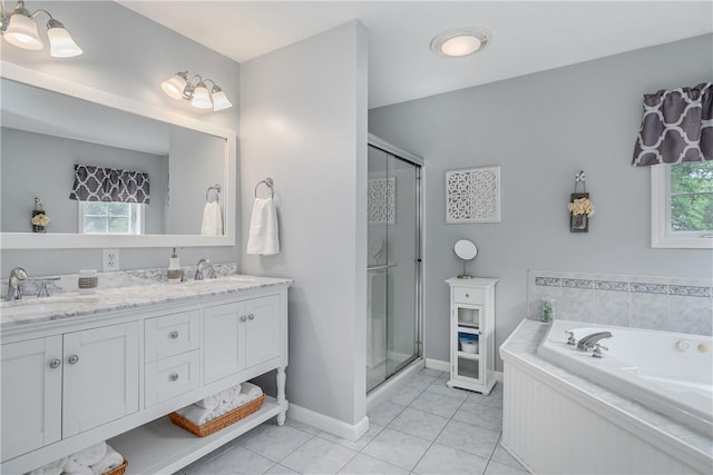 bathroom with tile patterned floors, independent shower and bath, and a healthy amount of sunlight