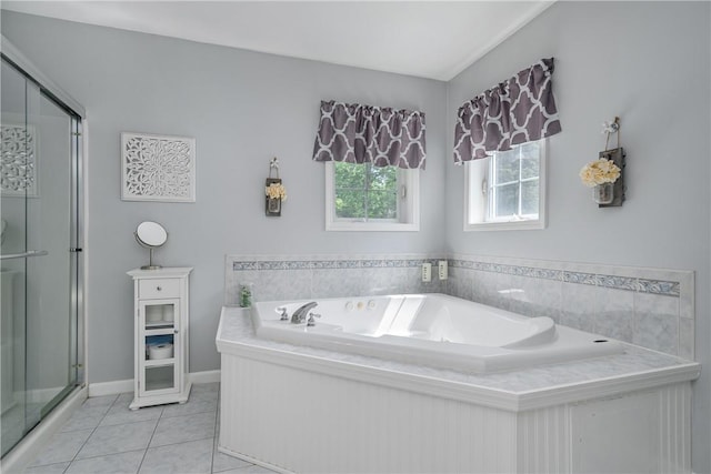 bathroom with tile patterned flooring and separate shower and tub