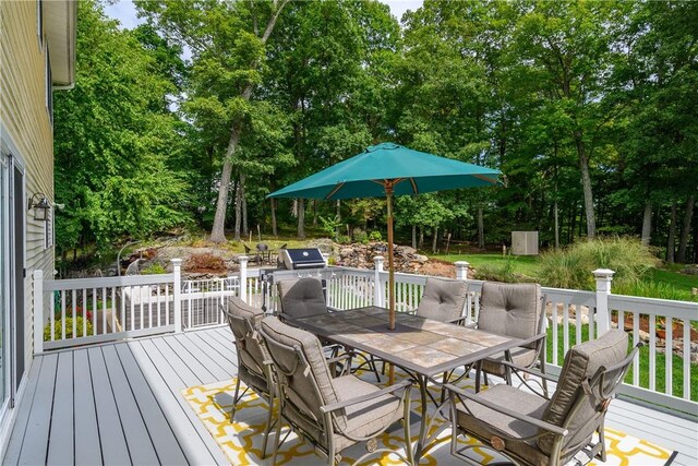 wooden deck with area for grilling