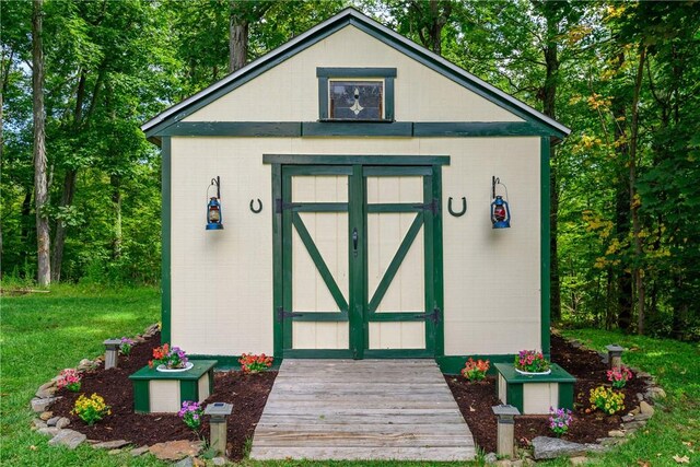 view of outdoor structure with a lawn