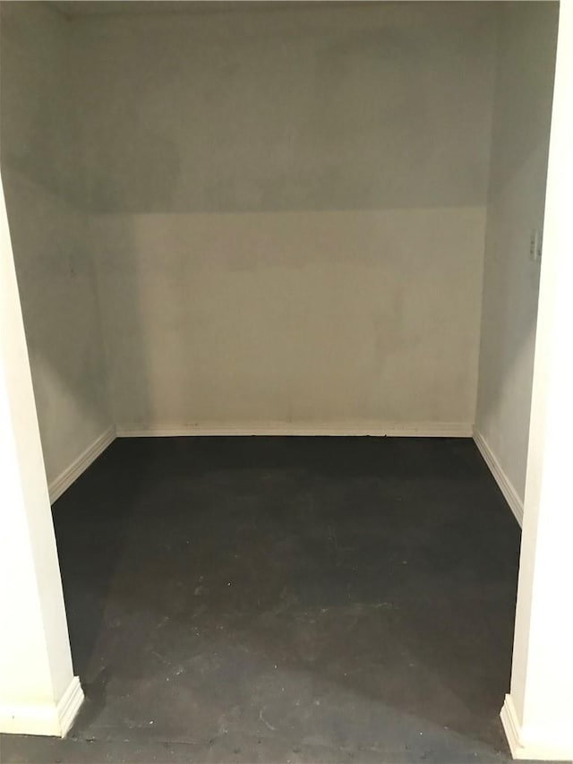 empty room featuring concrete flooring