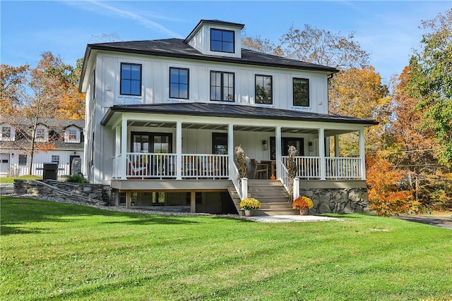 view of front facade with a porch and a front lawn