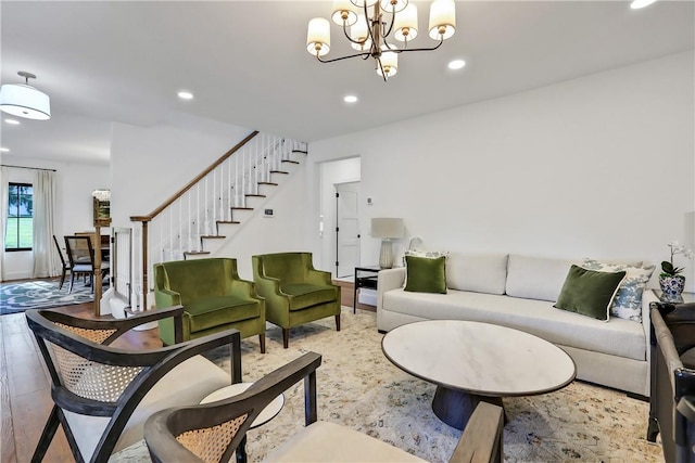 living room featuring hardwood / wood-style floors and a notable chandelier