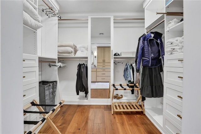 walk in closet featuring hardwood / wood-style floors