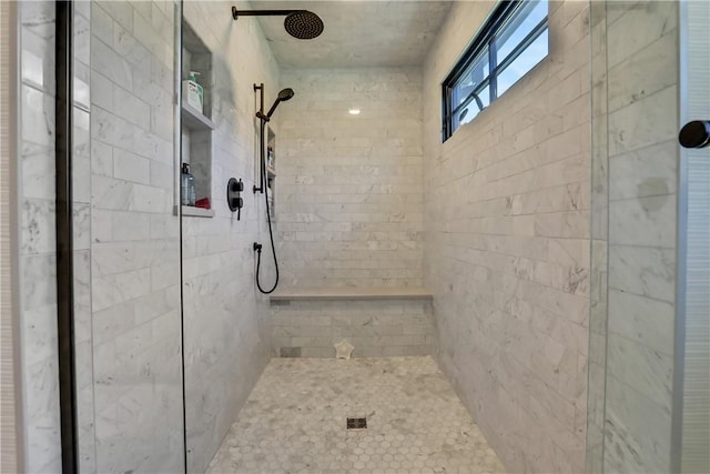 bathroom featuring tiled shower