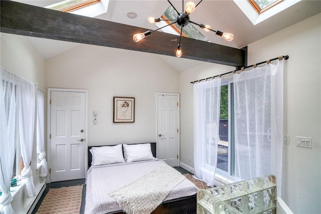 bedroom with vaulted ceiling with skylight