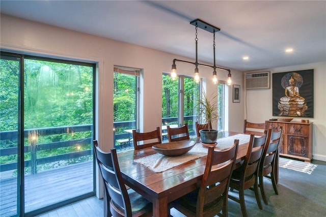 dining area featuring a wall mounted AC