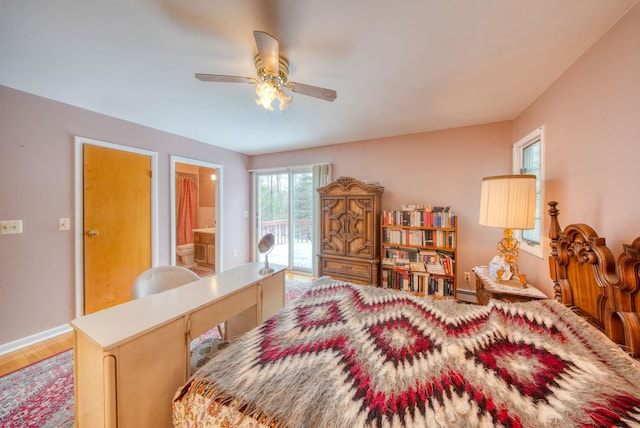 bedroom with access to exterior, baseboards, baseboard heating, and a ceiling fan