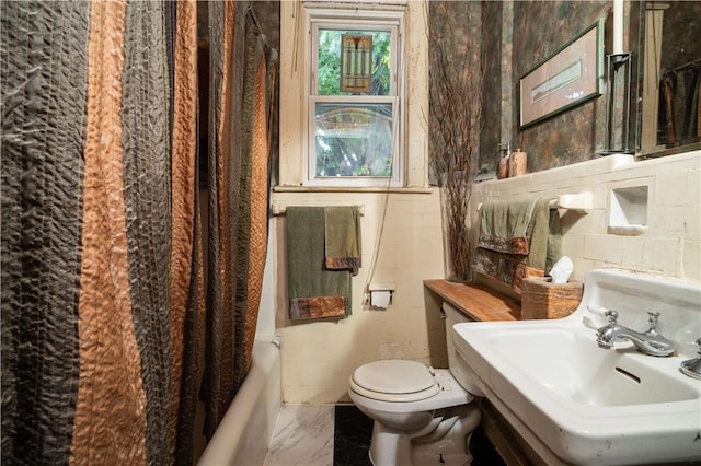 full bathroom featuring shower / bath combination with curtain, toilet, tile walls, and sink