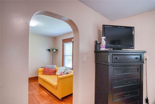 sitting room with hardwood / wood-style flooring