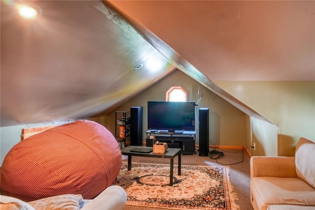 living room featuring lofted ceiling and carpet floors